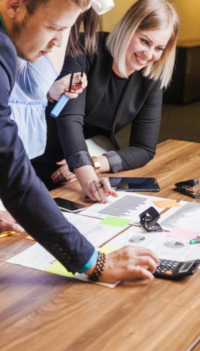 people-leaning-desk-standing